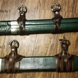 a close up of Universal Sword Suspension Straps on a table.