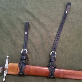 A universal sword suspension straps with a leather sheath and a leather strap.