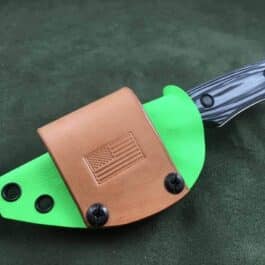 a Scout Style Kydex Sheath for Benchmade Hidden Canyon Hunter with a flag on it.