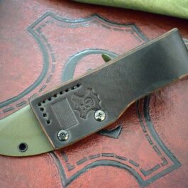 A Benchmade Saddle Mountain Skinner Kydex Sheath is laying on top of a leather case.