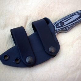 A Scout Style Kydex Sheath for Benchmade Hidden Canyon Hunter Style 2 on a table.