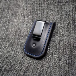 a black cell phone case with a blue stitch.