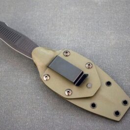 a Kydex Sheath for the Benchmade Fixed Infidel on a gray surface.