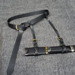 A Ranger Swordbelt on a gray fabric.