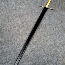 A Handmade leather Scabbard for the Albion Liechtenauer laying on top of a gray shirt.