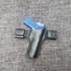 a Handmade Leather Snap Loop Pancake Holster Style 2 with a blue gun in it.