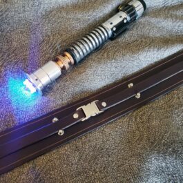 a close up of a Handmade Leather Space Wizard Belt on a bed.