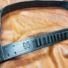 black Handmade Leather Bandolier laid on a cloth - renaissance clothing - renaissance clothing men - renaissance clothing women - renaissance clothing near me - renaissance costume ideas - sword baldrics - baldrics leather - baldric belt