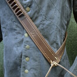 a close up of a person wearing a Handmade Leather Bandolier.
