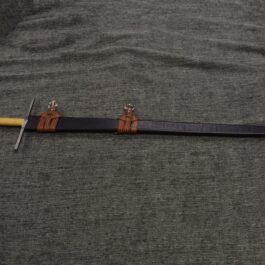 A Wood Core Scabbard for the Albion Liechtenauer on a gray cloth.