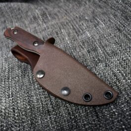 a Vertical Kydex Sheath for Benchmade Hidden Canyon Hunter on a gray cloth.