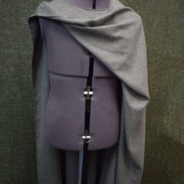 A Wool Bocksten Cloak on top of a mannequin.