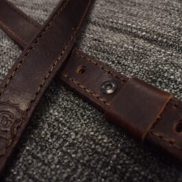 Close up of a dark brown Bison Leather Simple Sling with engraved logo - Grommet's Leathercraft - renaissance clothing - renaissance art clothing - renaissance era clothing - leathercraft supplies - leathercraft accessories - leathercraft store near me - quality leather craft