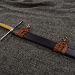A Wood Core Scabbard for the Albion Liechtenauer that is laying on a cloth.