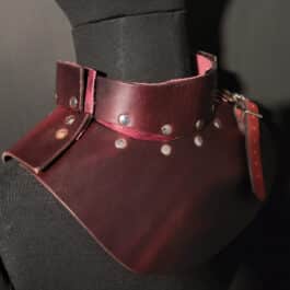 A close up of a mannequin wearing an Upgraded Handmade Leather Buttstock Cover.