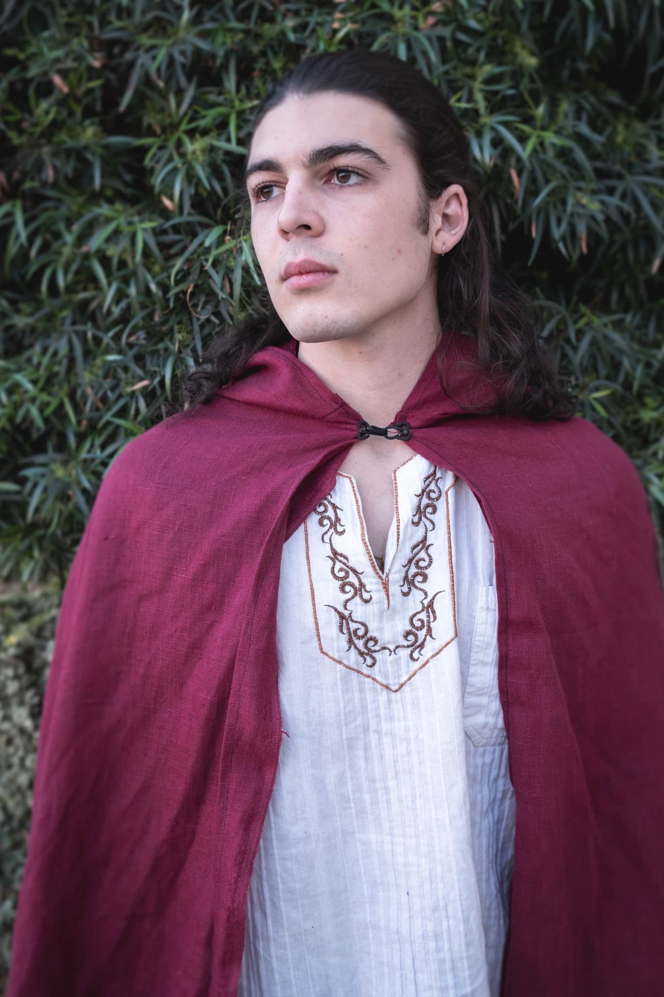 A man wearing a Linen Hooded Cloak.