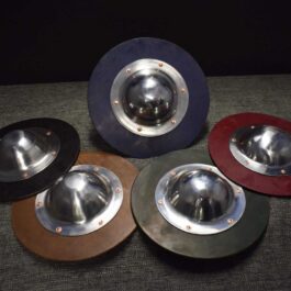 a Hardened Leather Buckler sitting on top of a table.