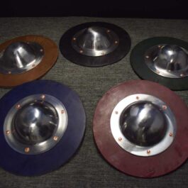 a Hardened Leather Buckler sitting on top of a table.