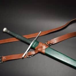 a Custom Wood Core Scabbard on a black surface.