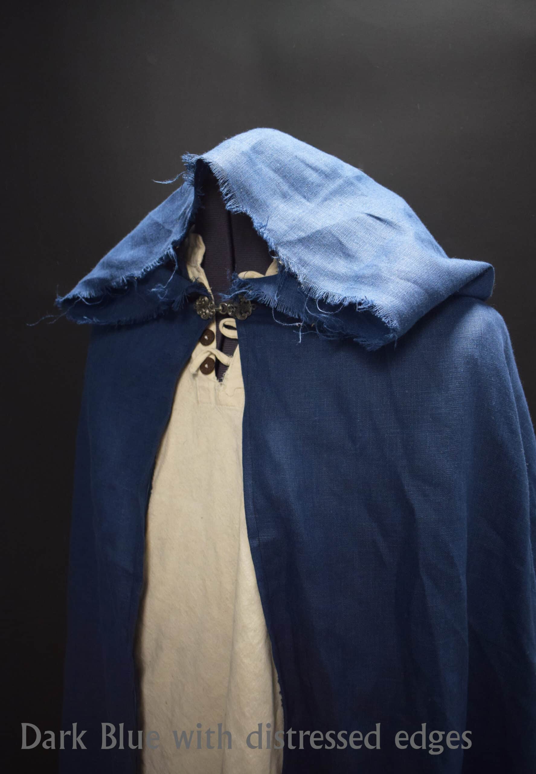 a Linen Hooded Cloak with a white shirt underneath it.