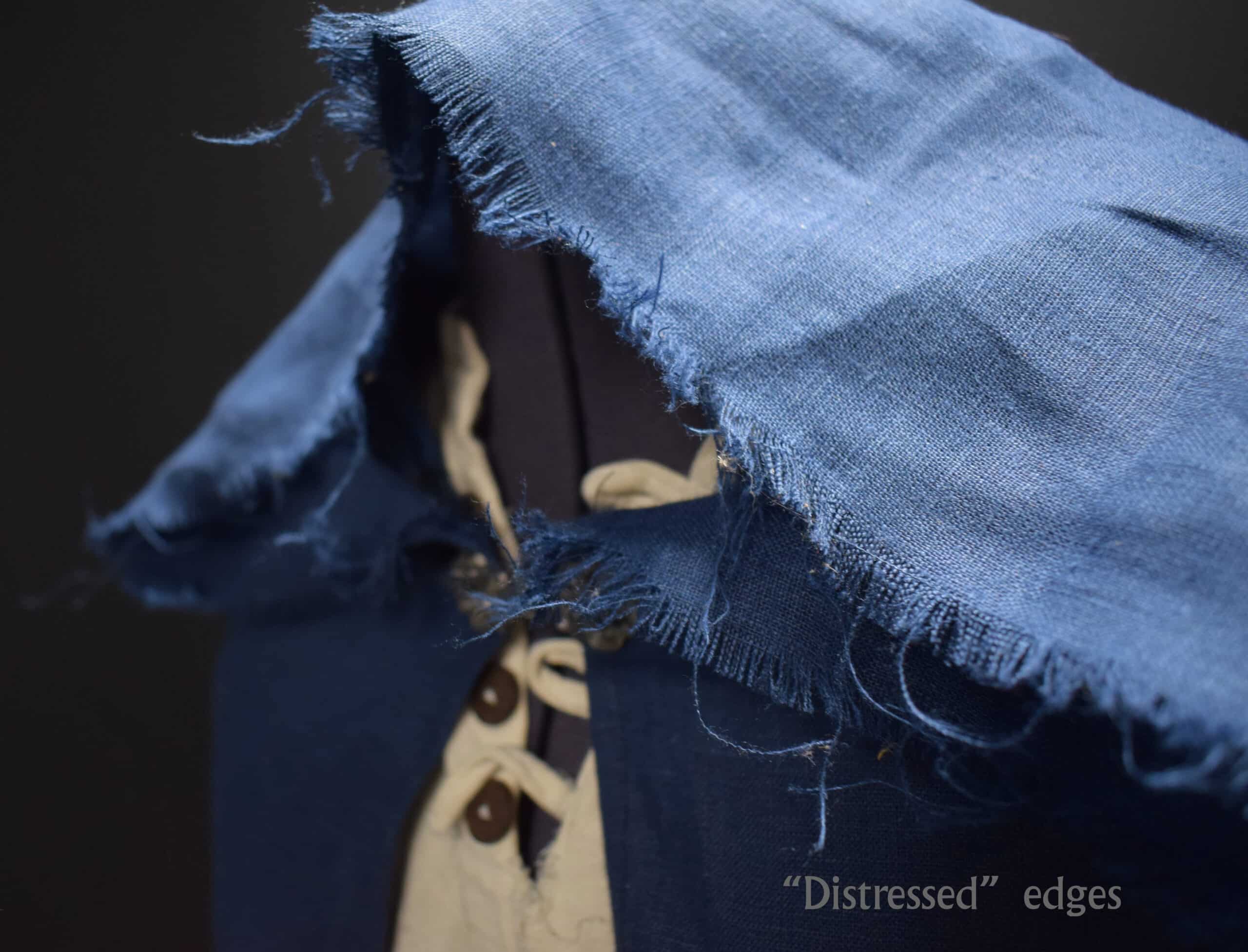 a Linen Hooded Cloak with a tie on it.