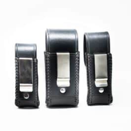 Three Handmade Leather Pouches with silver hardware on a white background.