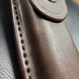 A close up of a Molded Leather Belt Pouch for a Benchmade Balisong.
