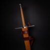 a Wood Core Scabbard for the Albion Liechtenauer attached to it.
