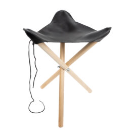 a black leather camp stool with wooden legs
