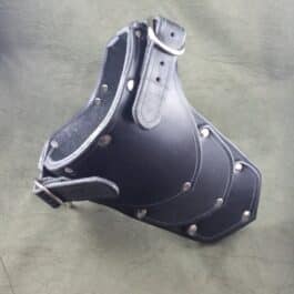 A black Handmade Leather Gorget Style 1 with rivets on it.