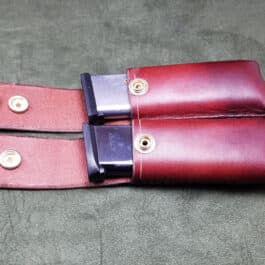 A 1911 Double Magazine Pouch on a gray surface.
