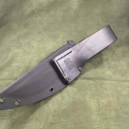 a knife is laying on a green cloth.