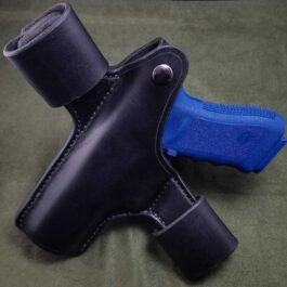 A Handmade Leather Snap Loop Pancake Holster with a blue handle.
