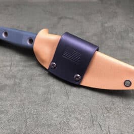 A Scout Style Benchmade Bushcrafter Sheath Style 2 on a table.