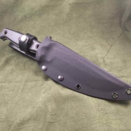 a knife is laying on a green cloth.