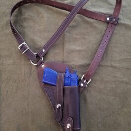 a brown leather holster with a blue gun in it.