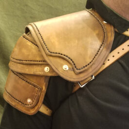 a close up of a person wearing a leather belt.