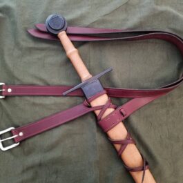 An Integrated Sword Belt with purple leather straps and a metal buckle.