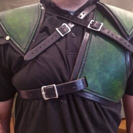 a man wearing a green leather armor and a black shirt.