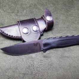 a knife that is laying on a table.