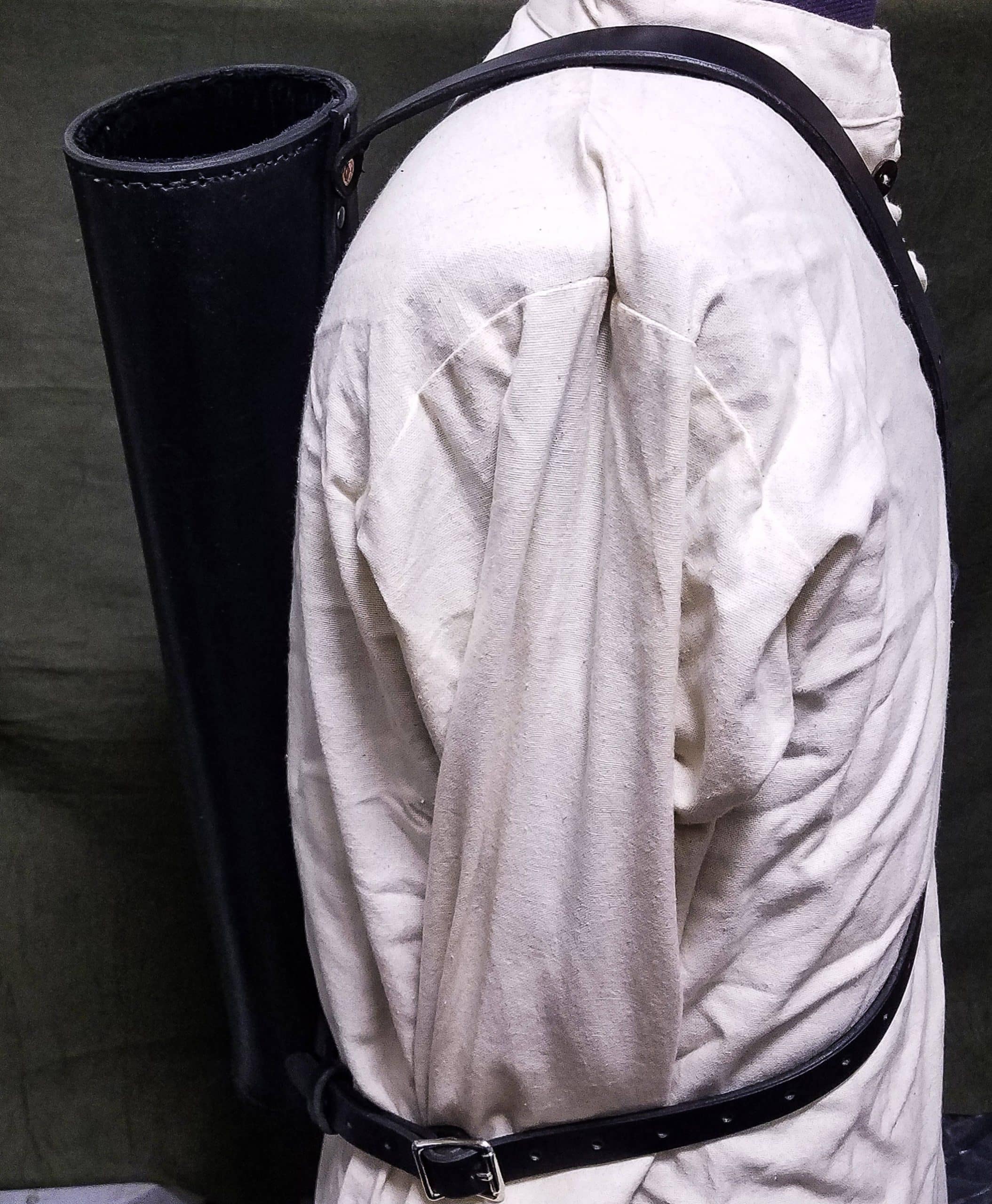 The Basic Back Quiver on a person wearing a white suit.