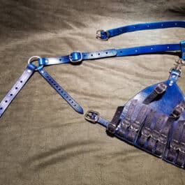 a piece of blue leather with straps attached to it.