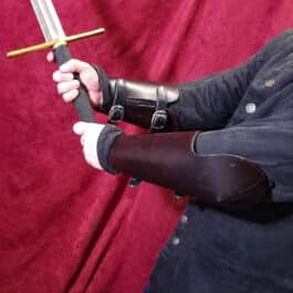 a man holding a sword in his right hand.