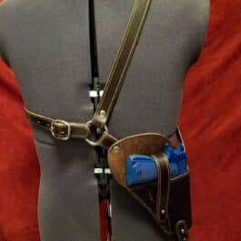 a mannequin with a gun and holster on it.