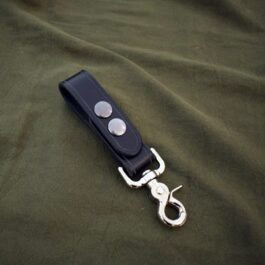 A black Leather Dangler Loop with a pair of scissors on it.