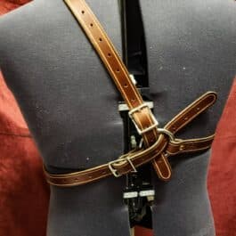 a mannequin wearing a leather harness.