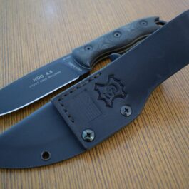 A TOPS HOG 4.5 Kydex Sheath knife on a table.