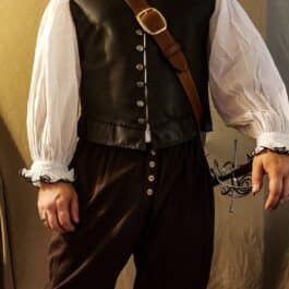 A man wearing a Renaissance Baldric and a white shirt.