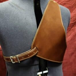 a mannequin wearing a brown leather belt.