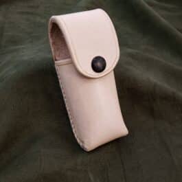 A Handmade Leather Pouch with a button on it.